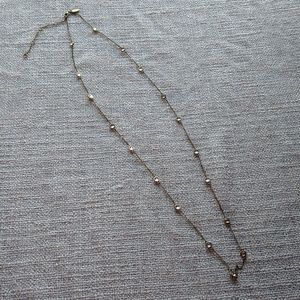 Brass and crystal necklace.